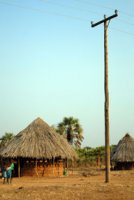 Electricity passes over a village resettled for Kariba Dam, Zimbabwe (Karin Retief)